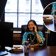 Haaland works in her office at the U.S. Capitol before being sworn in. In the table a bottle can be seen with a Pueblo Action Alliance sticker